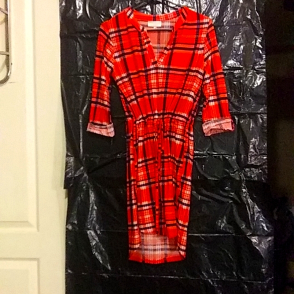 Bobbie Brooks orange,blue & white plaid dress lays right above the knee